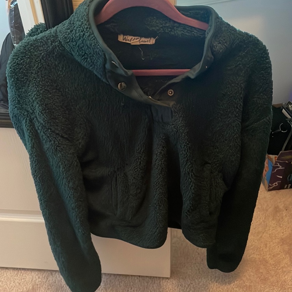 Green fluffy throw over